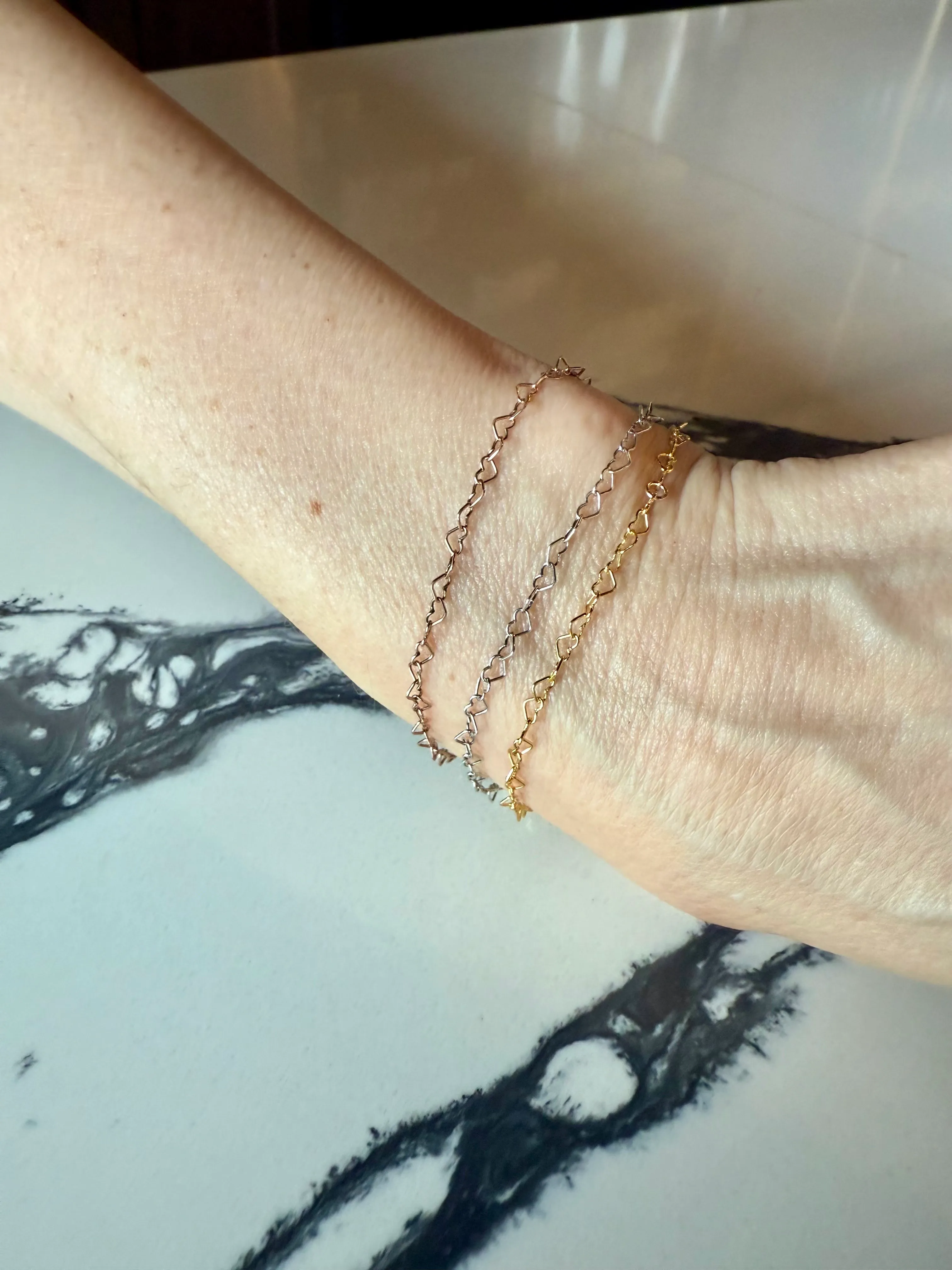 Three heart charm bracelets