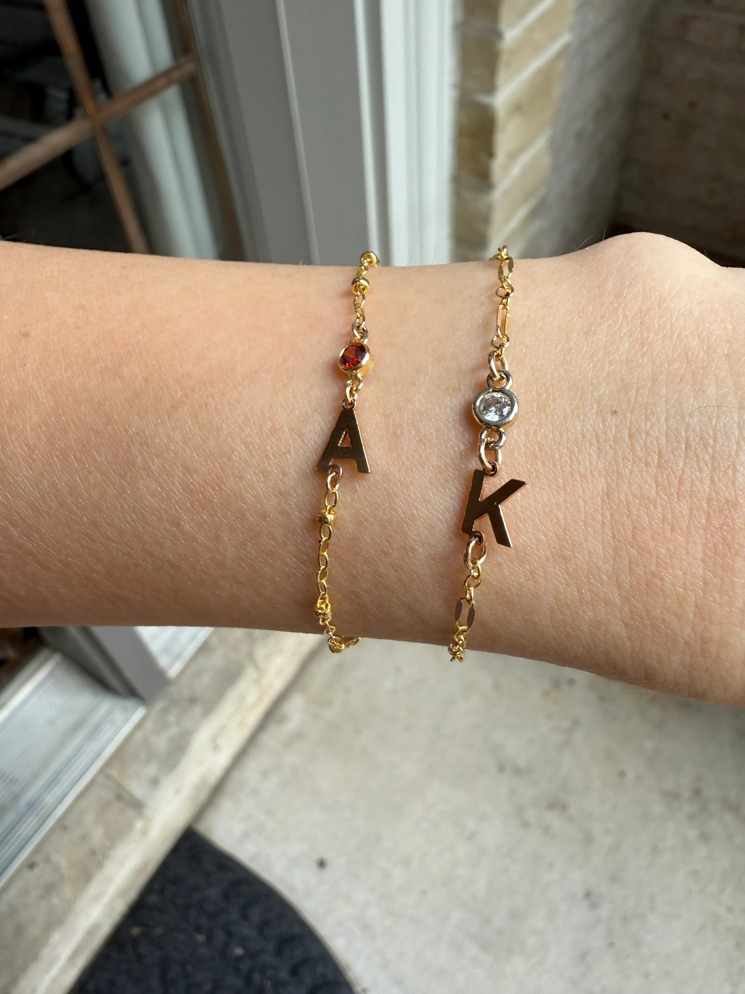 Birthstone and letter charm bracelet