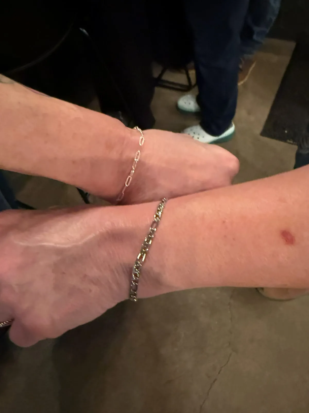 Couple with matching permanent jewelry