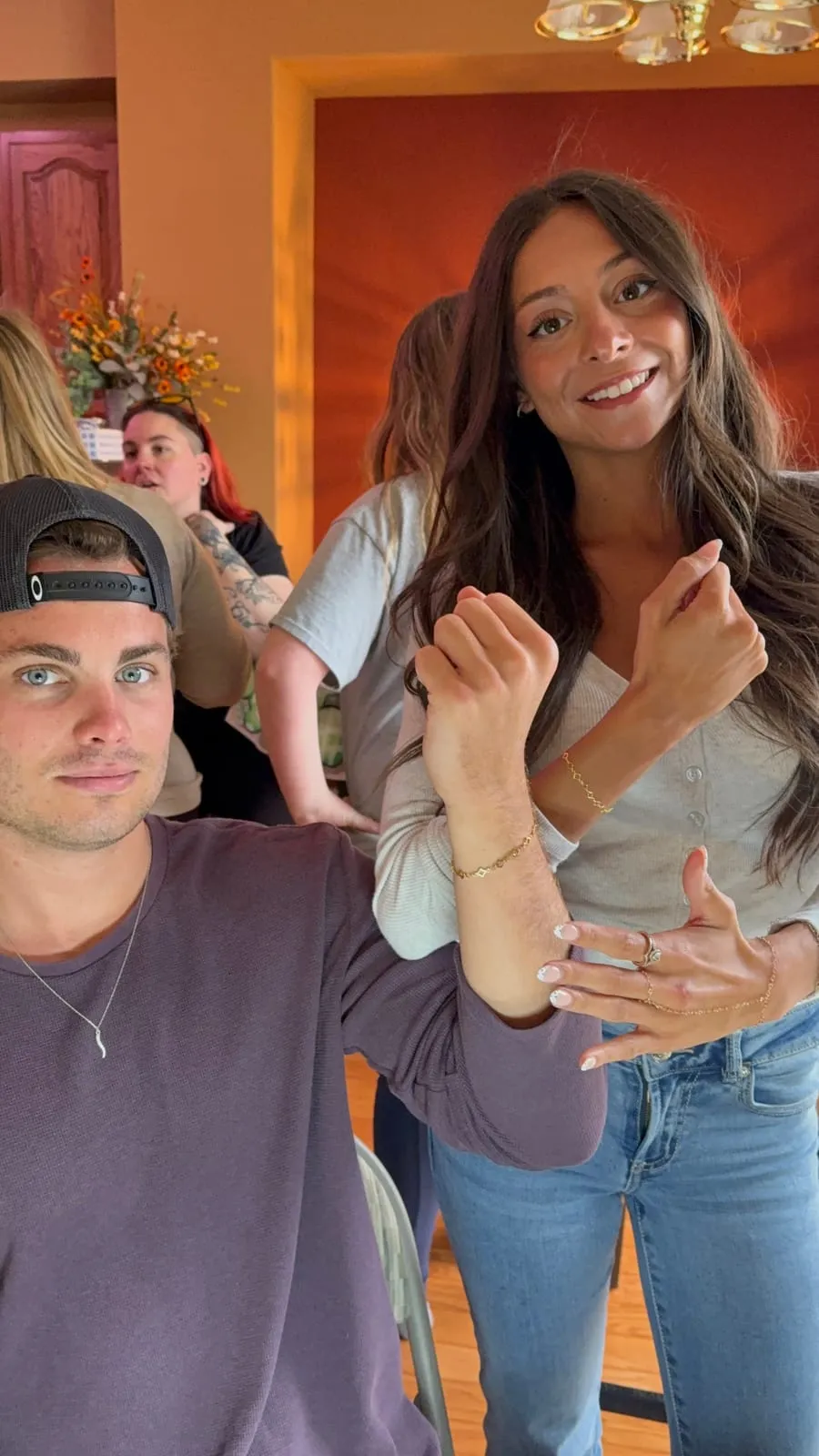 Couple with matching permanent jewelry