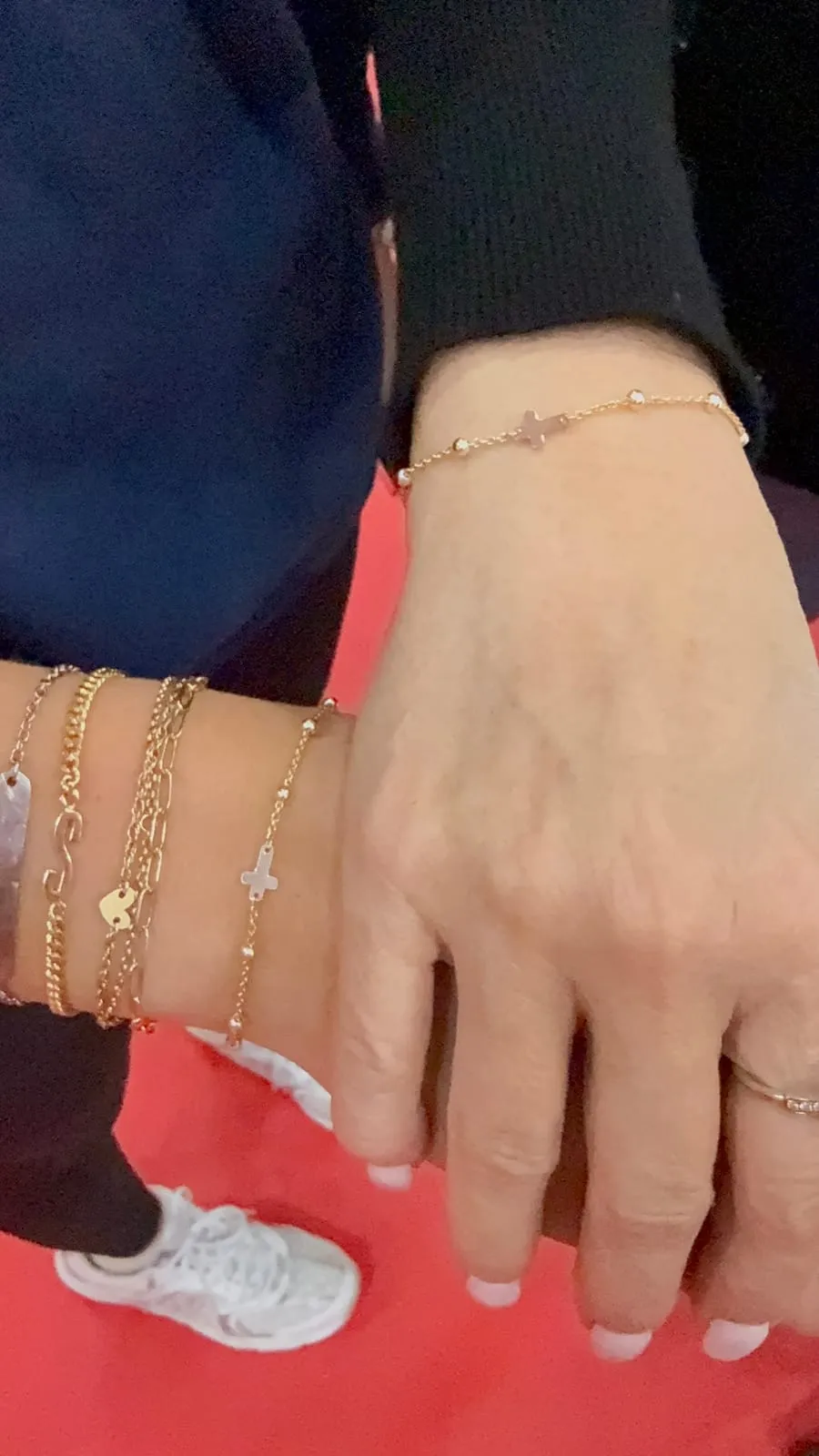 Mother and daughter with matching permanent jewelry