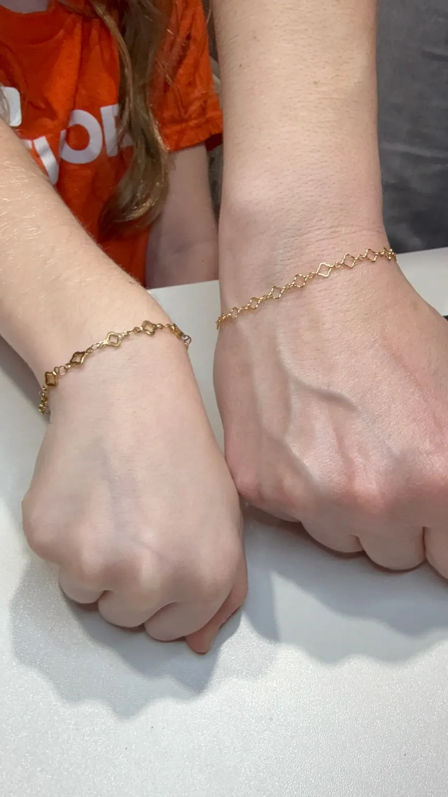 Mother and daughter with matching permanent jewelry