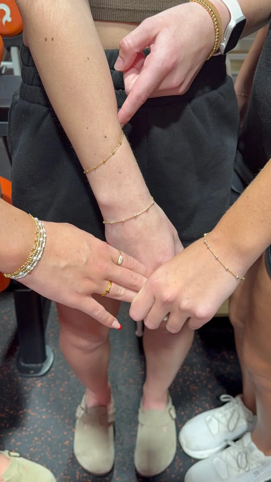 Friends with matching permanent jewelry