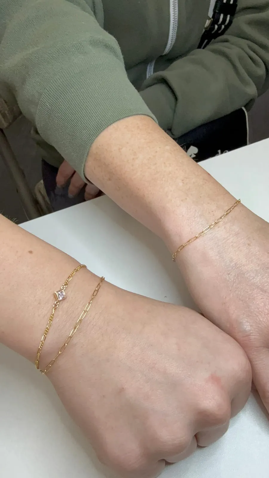 Mother and daughter with matching permanent jewelry