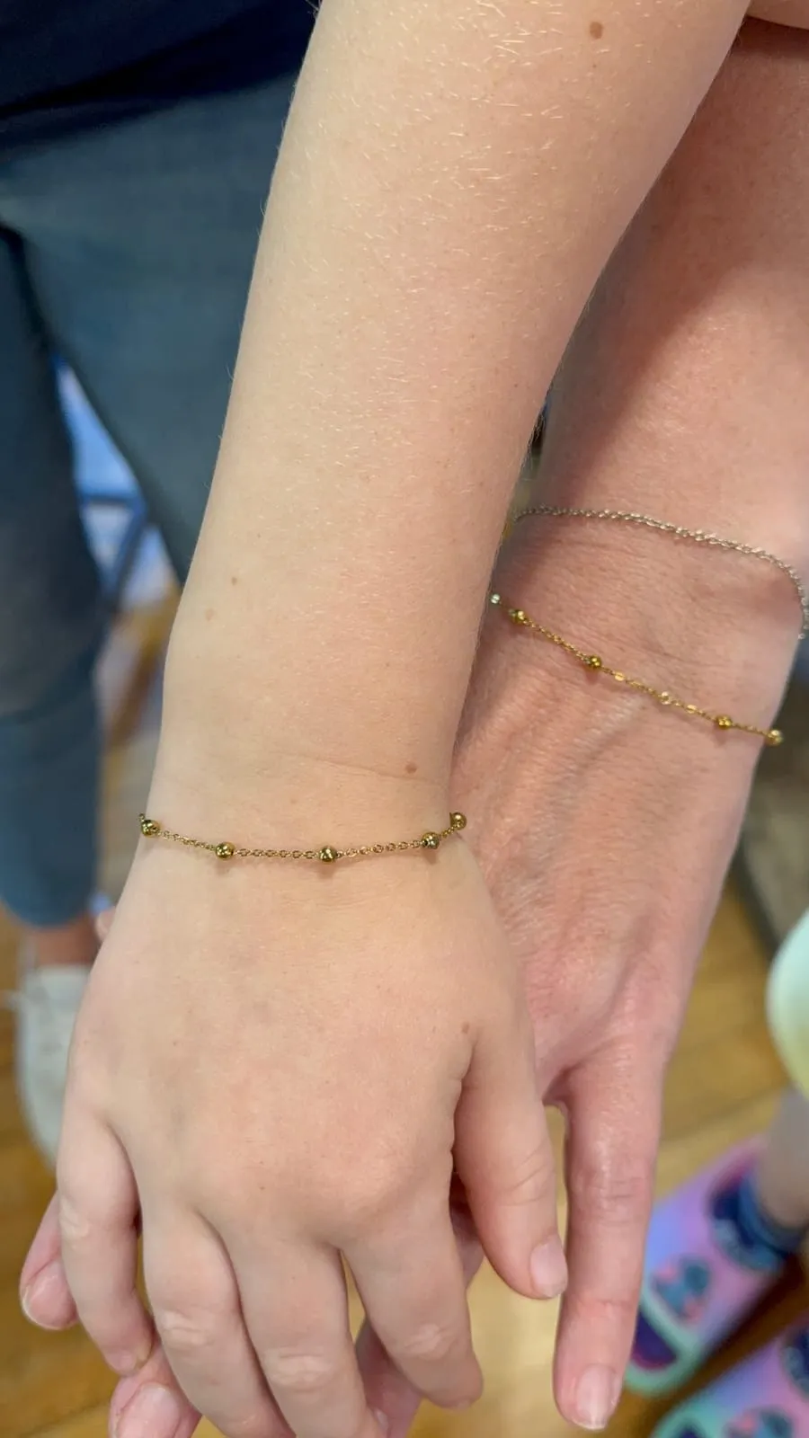 Mother and daughter with matching permanent jewelry