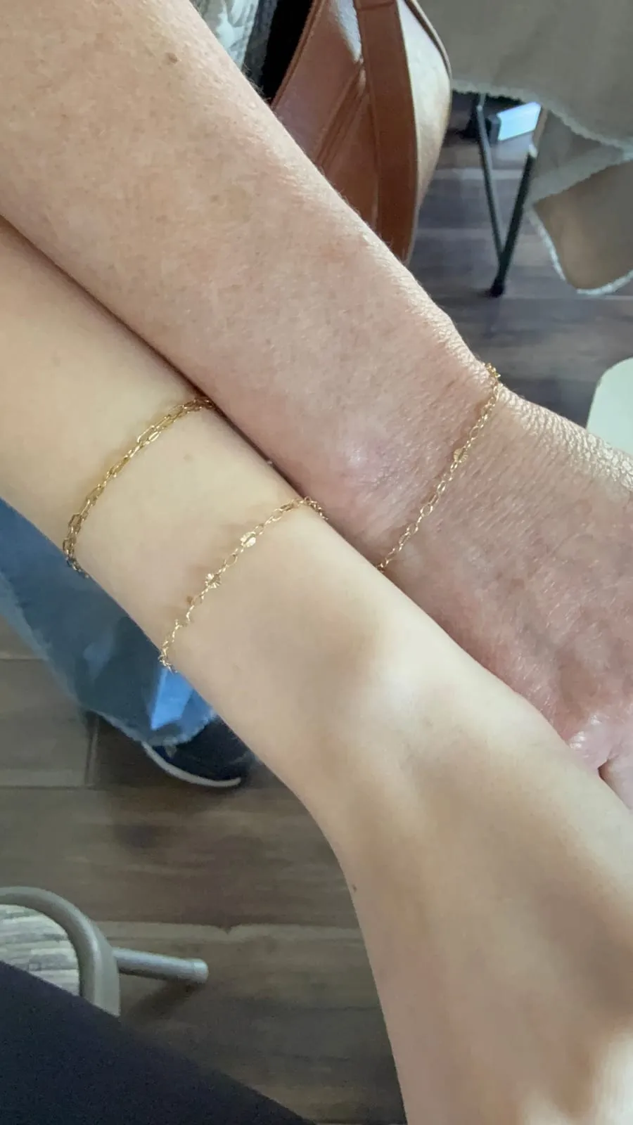 Mother and daughter with matching permanent jewelry