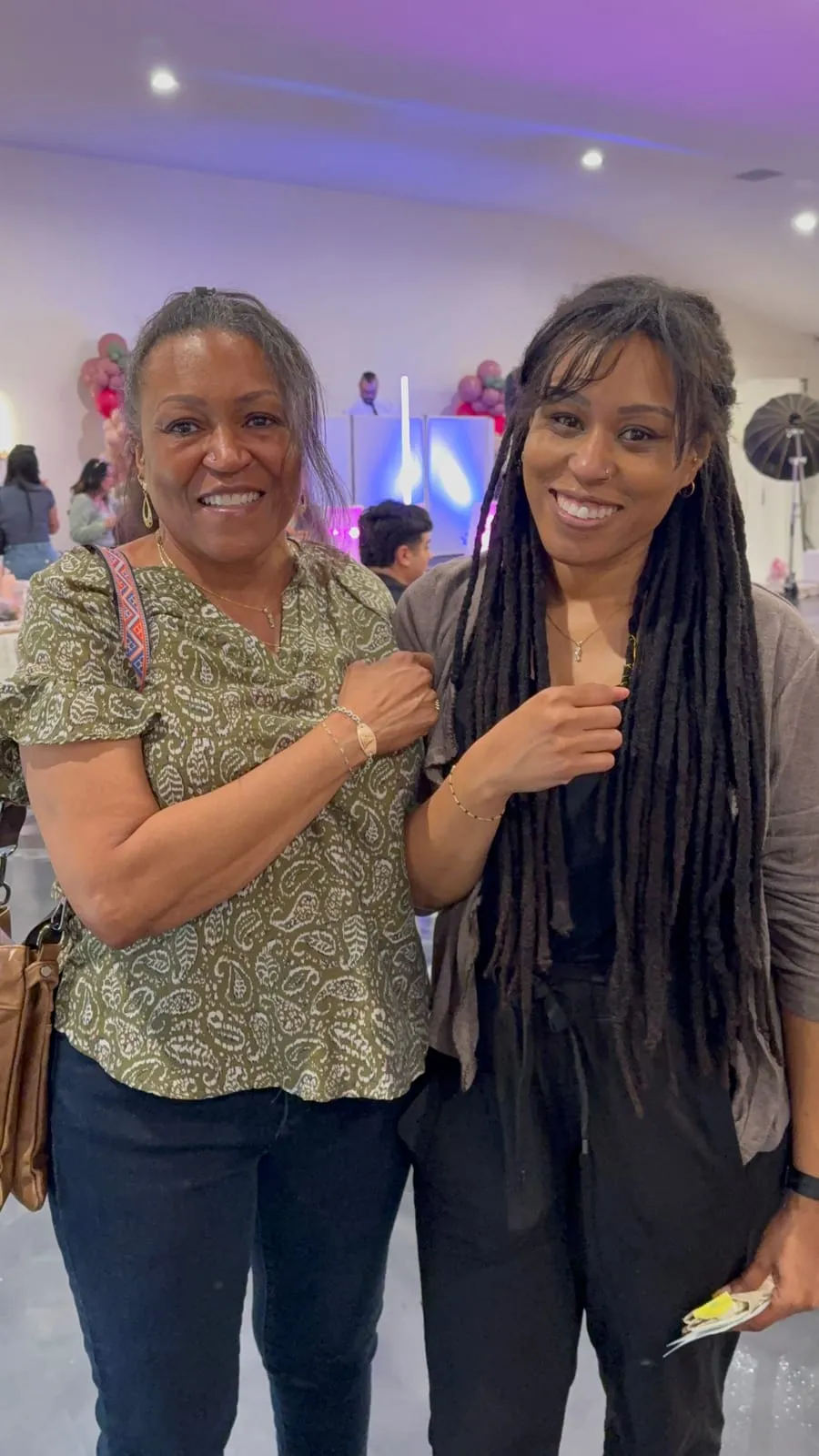 Mother and daughter with matching permanent jewelry
