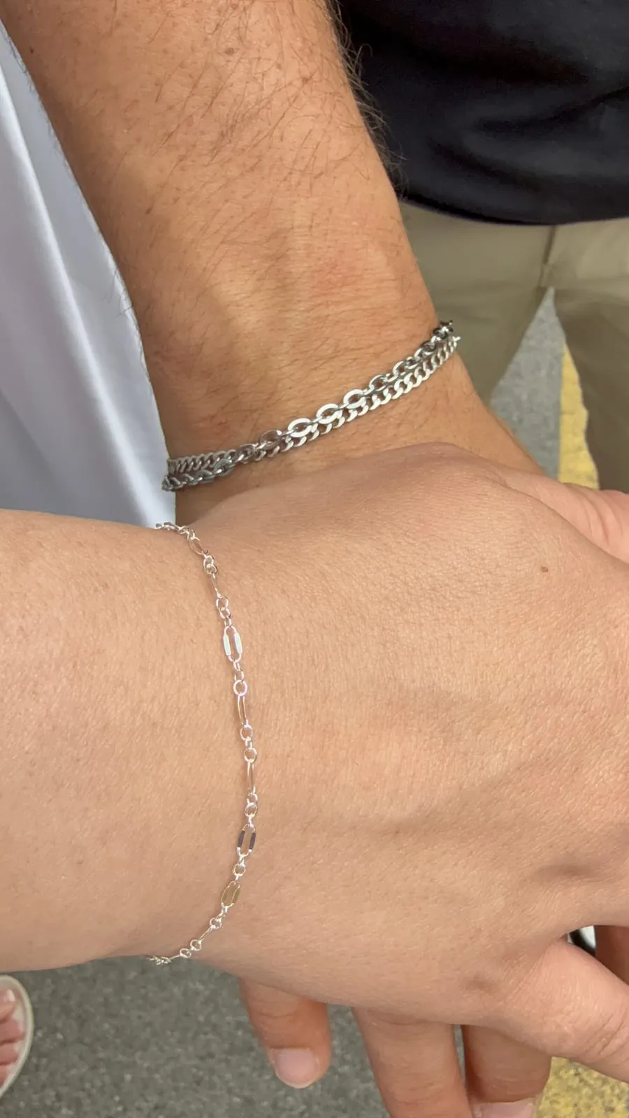 Couple with matching permanent jewelry