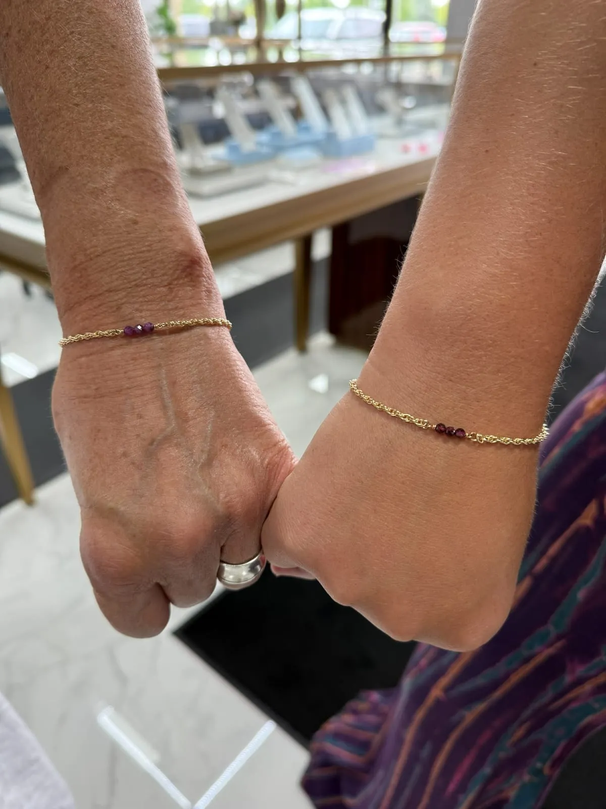 Mother and daughter with matching permanent jewelry