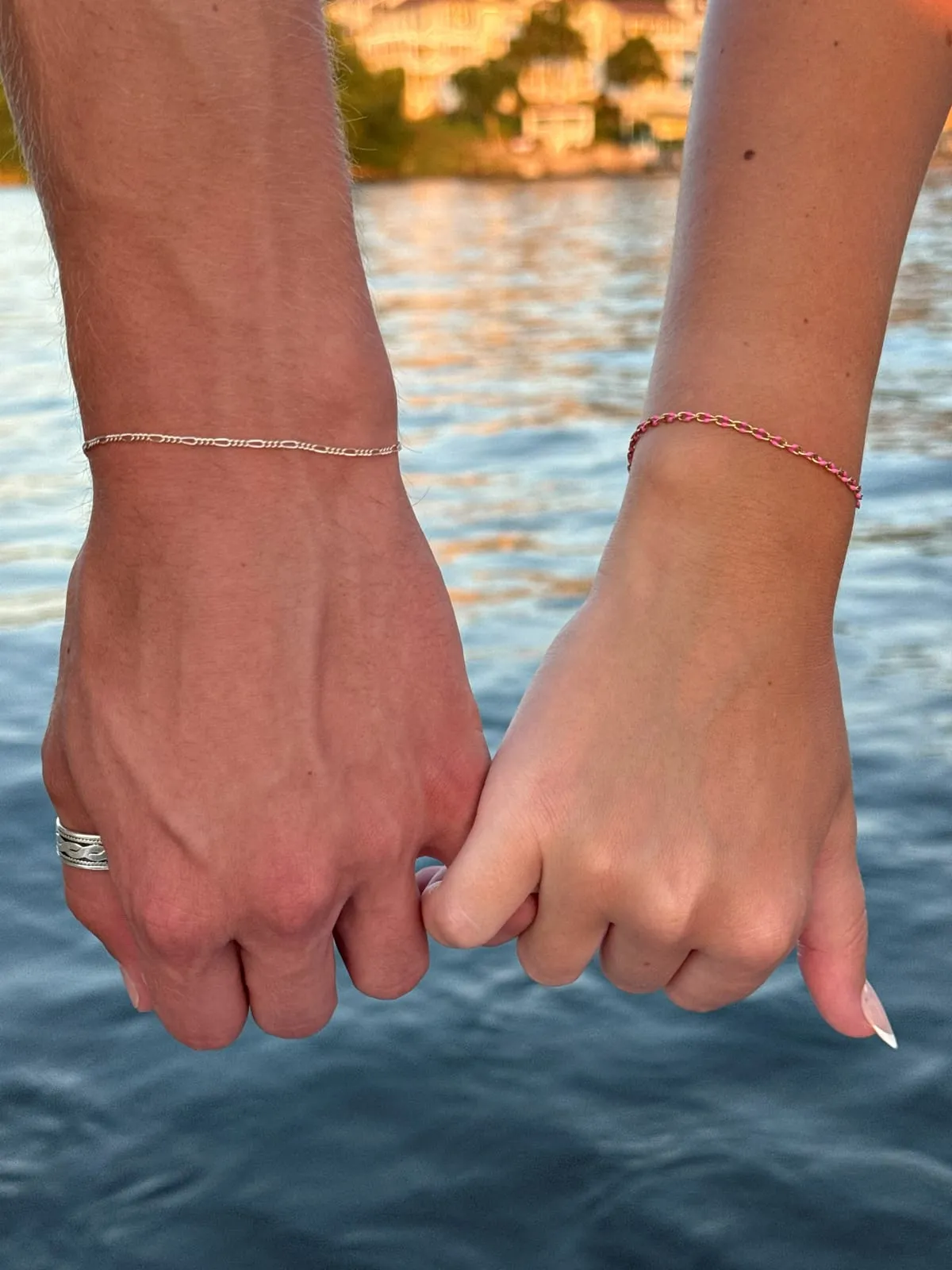 Couple with matching permanent jewelry